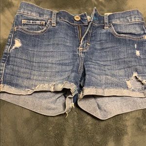 dark blue ripped jean shorts